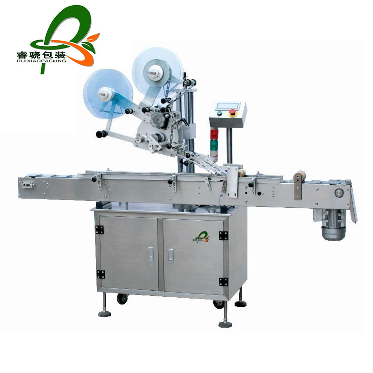 Automatic top labeling machine